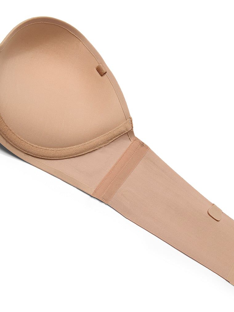 Biustonosz push-up bez ramiączek Strapless. Produkt ma kolor beżowy i pochodzi z kolekcji Invisible by Victoria's Secret. 