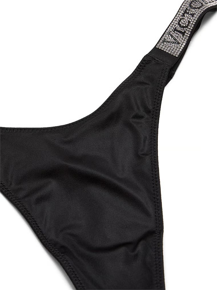 Stringi z błyszczącymi paskami Shine Strap. Produkt ma kolor czarny i pochodzi z kolekcji Very Sexy. 