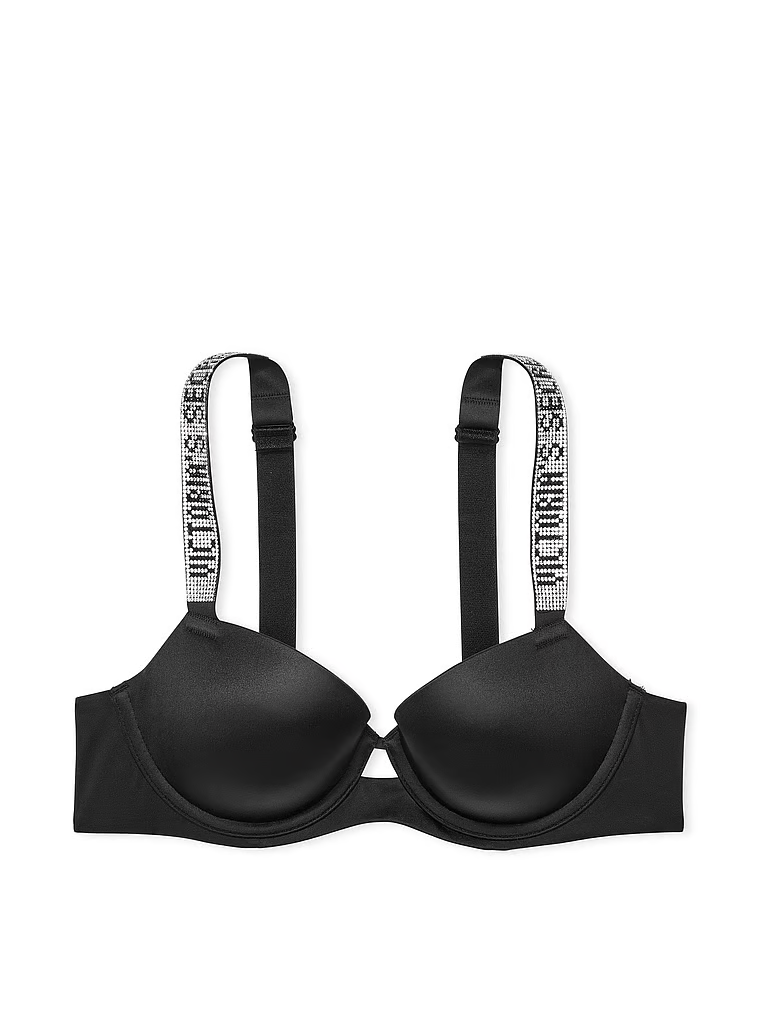 Na zdjęciu na białym tle widoczny jest biustonosz lekko usztywniany z błyszczącymi ramiączkami Shine Strap Demi. Produkt ma kolor czarny i pochodzi z kolekcji Very Sexy.