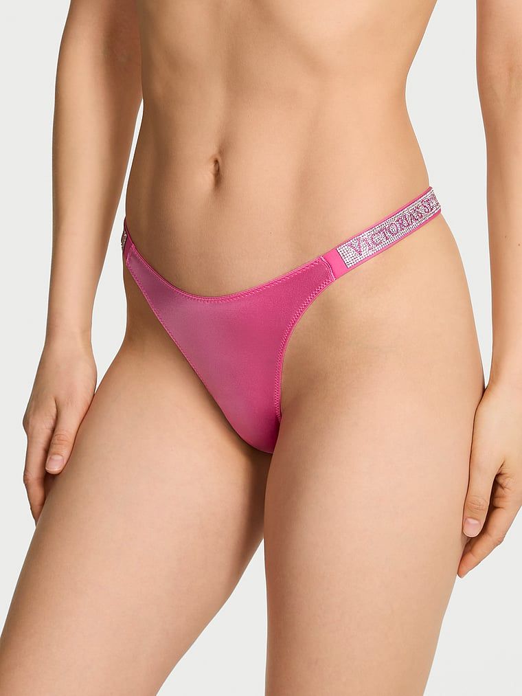 Stringi z błyszczącymi paskami Shine Strap. Produkt ma kolor różowy i pochodzi z kolekcji Very Sexy. 