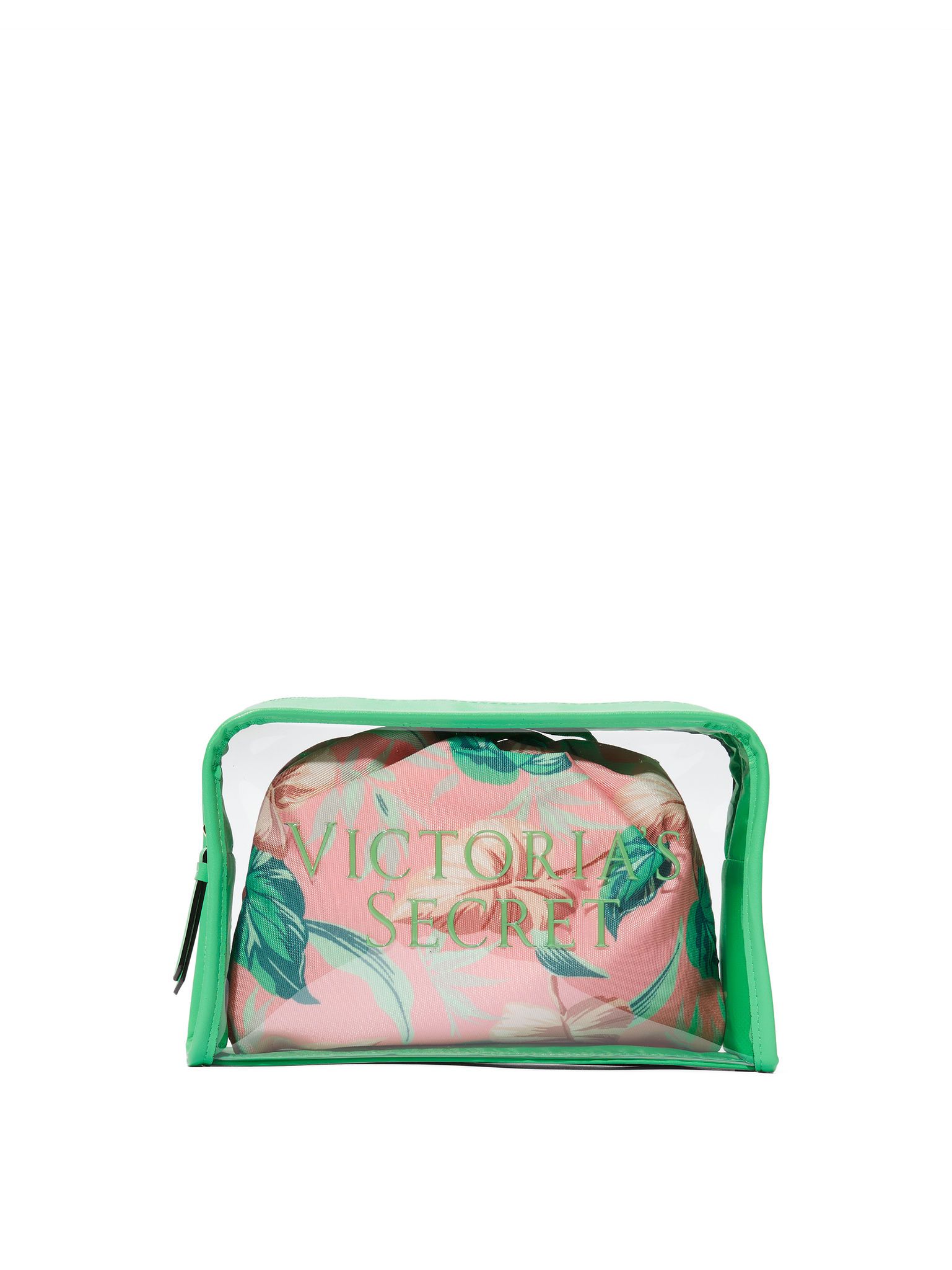 Przezroczysta kosmetyczka Victoria's Secret z zielonymi brzegami, w środku różowa kosmetyczka z tropikalnym wzorem.
