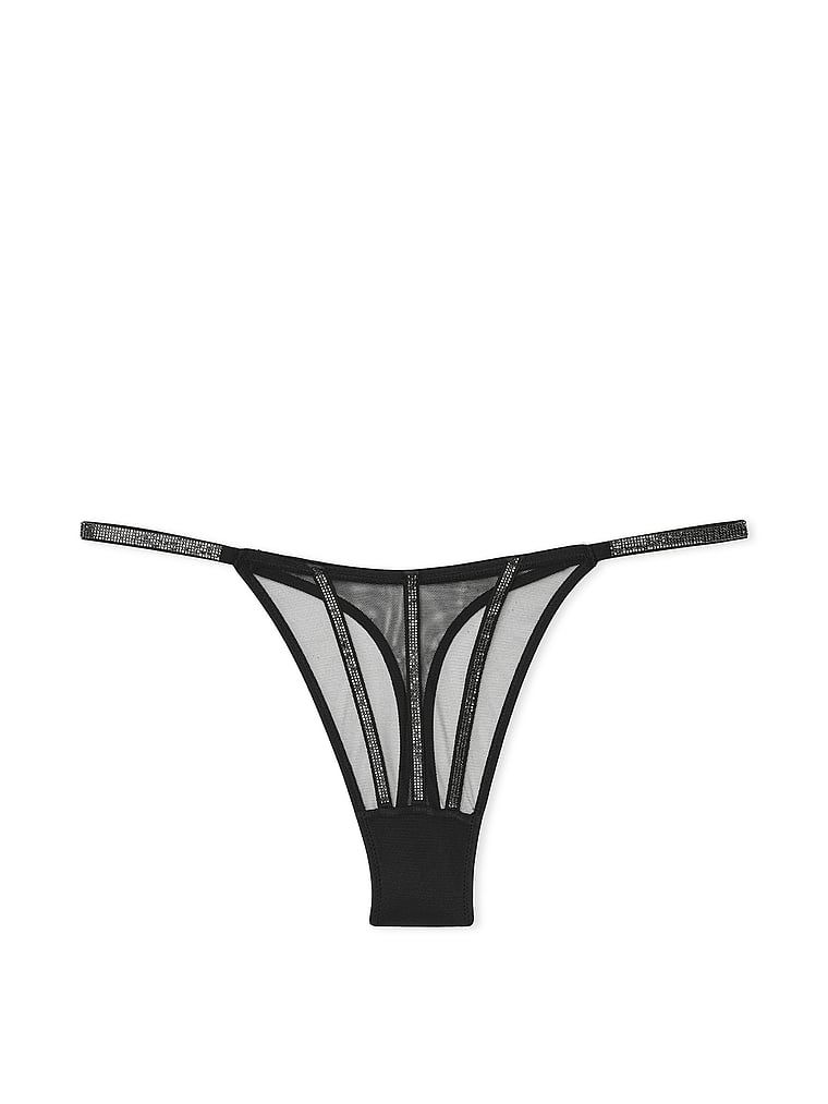 Stringi z błyszczącymi paseczkami Sheer Shine. Produkt ma kolor czarny i pochodzi z kolekcji Very Sexy. 