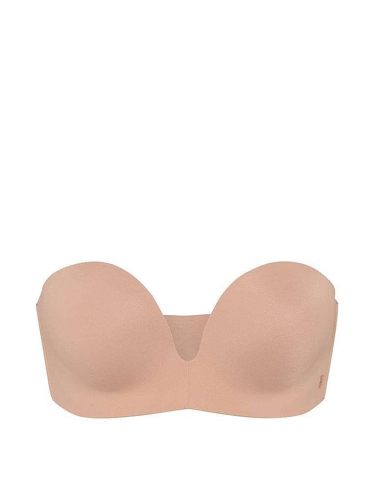 Biustonosz push-up bez ramiączek powiększający o 2 rozmiary Bombshell. Produkt ma kolor beżowy i pochodzi z kolekcji Invisible by Victoria's Secret. 