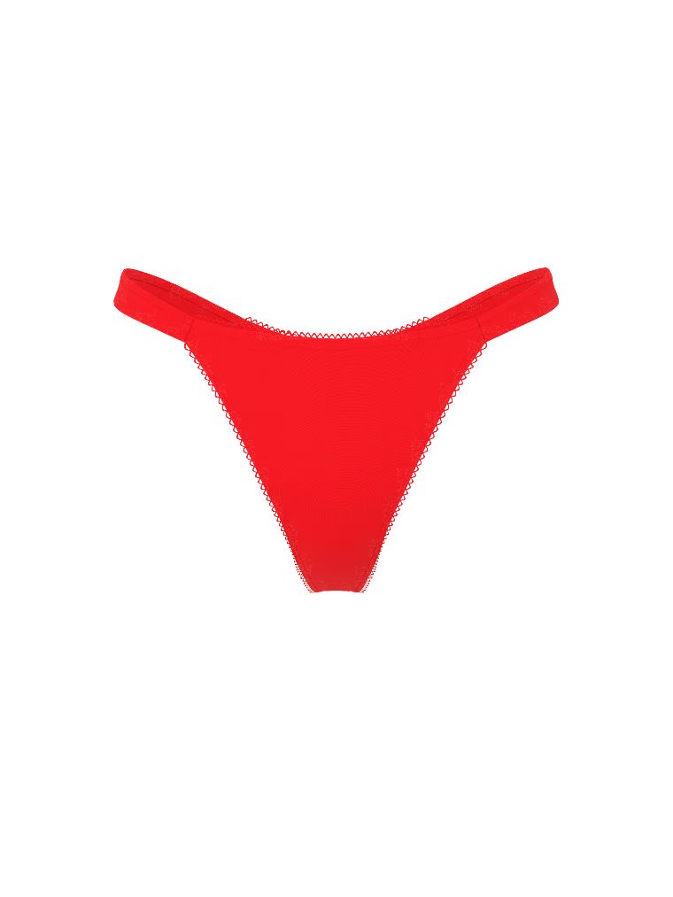 Stringi z pomponami Pom Pom Bow. Produkt ma kolor czerwony i pochodzi z kolekcji Dream Angels. 