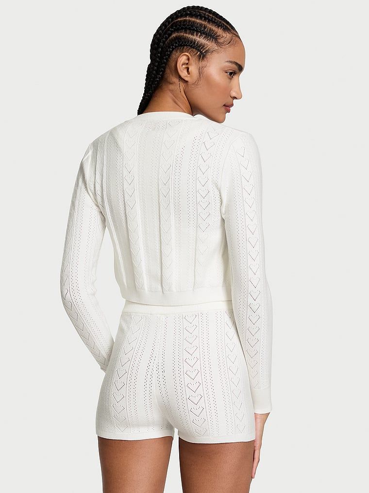 Sweterek crop top na suwak z dziurkowanego materiału Luxe Heart Pointelle. Produkt ma kolor biały i pochodzi z kolekcji Victoria's Secret. 