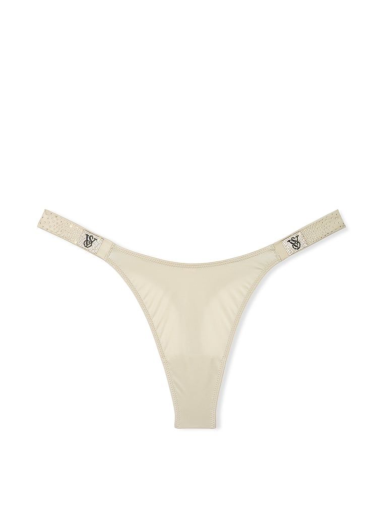 Stringi z błyszczącymi paseczkami Scattered Shine Strap. Produkt ma kolor beżowy i pochodzi z kolekcji Very Sexy. 