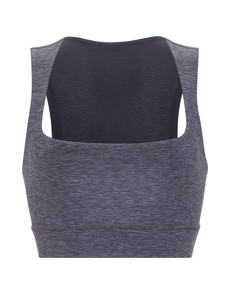 Biustonosz sportowy top VSX New Essential. Produkt ma kolor wzorzysty i pochodzi z kolekcji VSX. 