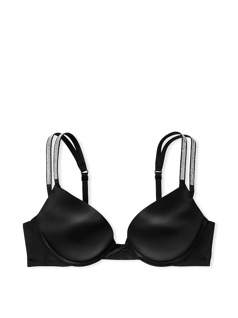 Na zdjęciu na białym tle widoczny jest biustonosz push-up powiększający o 2 rozmiary Bombshell Double Shine Strap. Produkt ma kolor czarny i pochodzi z kolekcji Very Sexy.