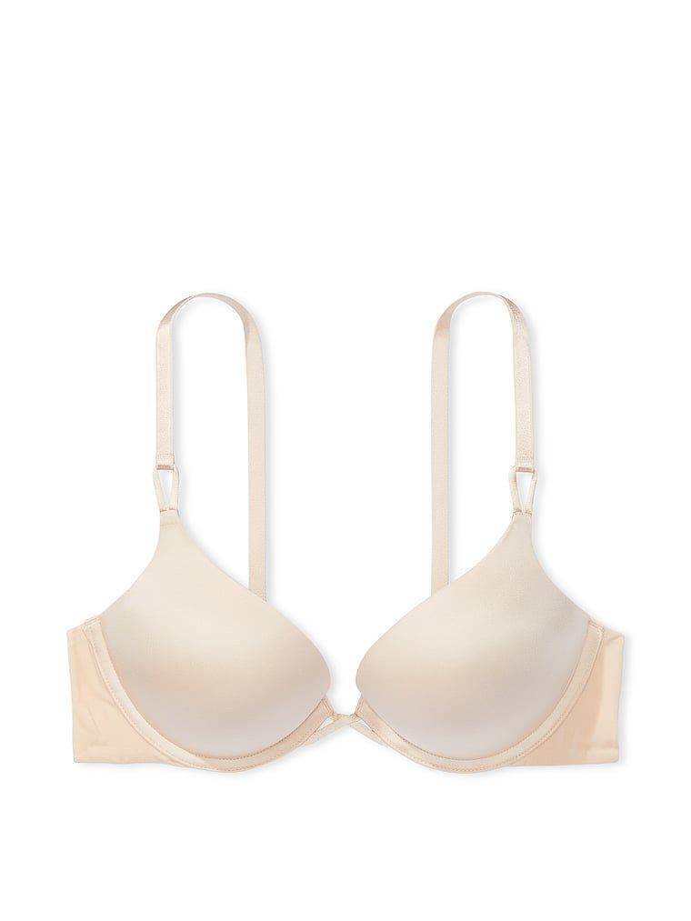Na zdjęciu na białym tle widoczny jest biustonosz push-up powiększający o 2 rozmiary Bombshell. Produkt ma kolor beżowy i pochodzi z kolekcji Very Sexy.