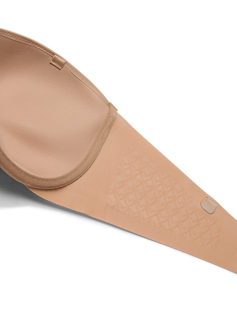Biustonosz lekko usztywniany bez ramiączek Strapless. Produkt ma kolor beżowy i pochodzi z kolekcji Invisible by Victoria's Secret. 