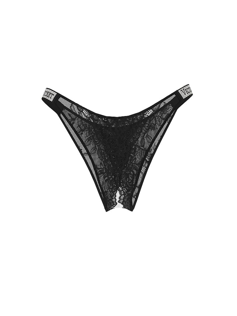 Majtki koronkowe brazyliany bez kroku z błyszczącymi paskami Shine Strap. Produkt ma kolor czarny i pochodzi z kolekcji Very Sexy. 