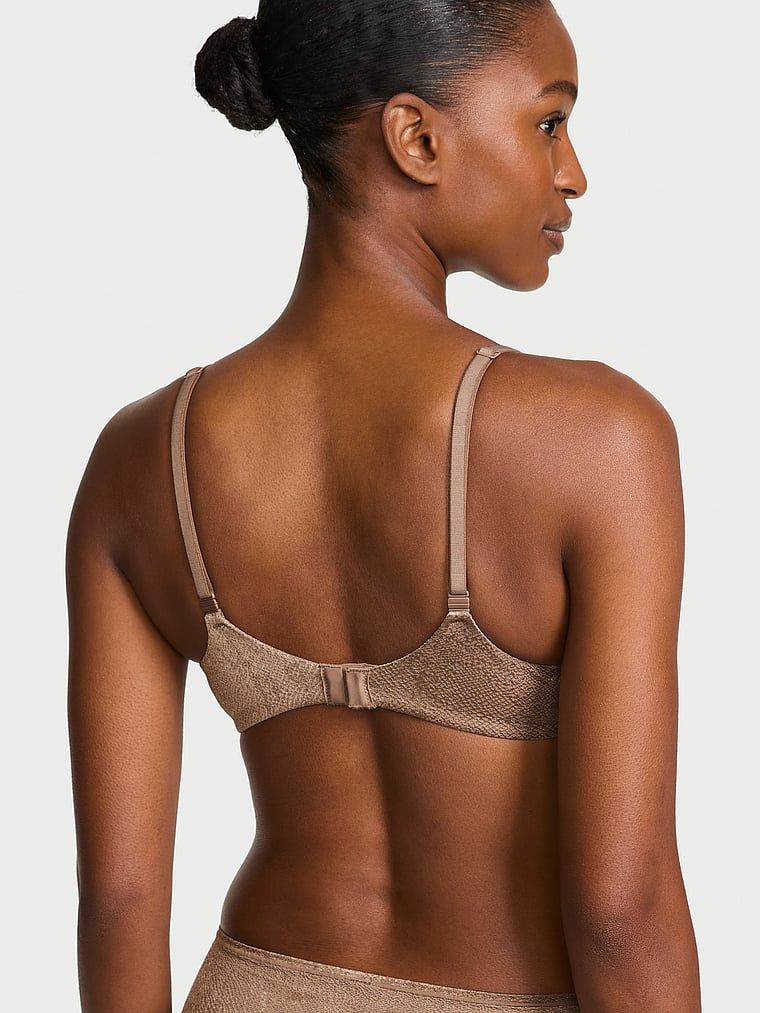 Biustonosz lekko usztywniany z mocno zabudowanymi miseczkami. Produkt ma kolor brązowy i pochodzi z kolekcji Body by Victoria. 