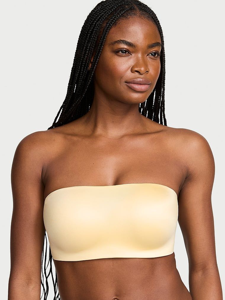 Biustonosz push-up bez ramiączek i bez fiszbin Bandeau. Produkt ma kolor żółty i pochodzi z kolekcji Invisible by Victoria's Secret. 