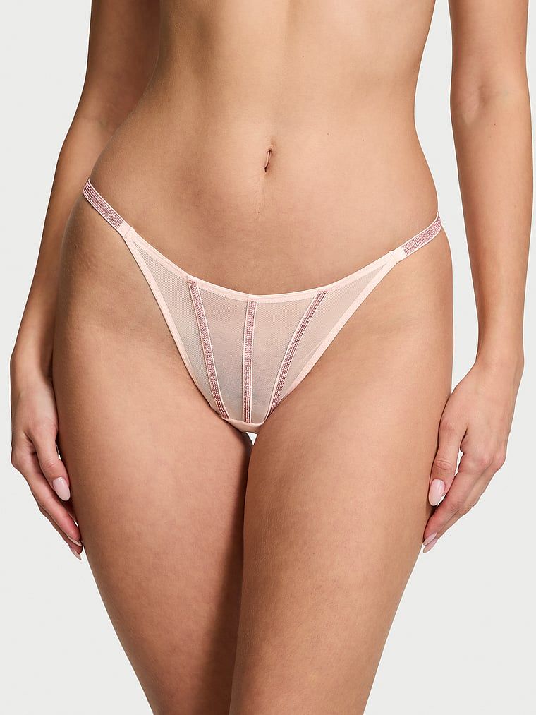 Stringi z błyszczącymi paseczkami Sheer Shine. Produkt ma kolor różowy i pochodzi z kolekcji Very Sexy. 