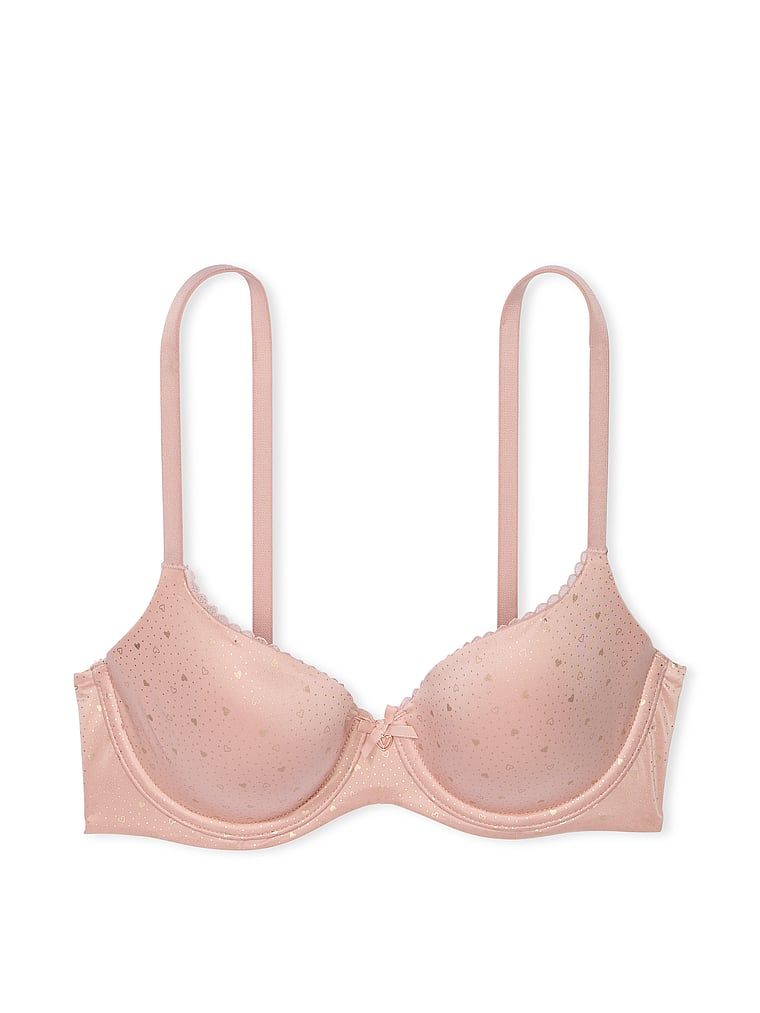 Na zdjęciu na białym tle widoczny jest biustonosz lekko usztywniany Smooth Demi. Produkt jest wzorzysty i pochodzi z kolekcji Body by Victoria.