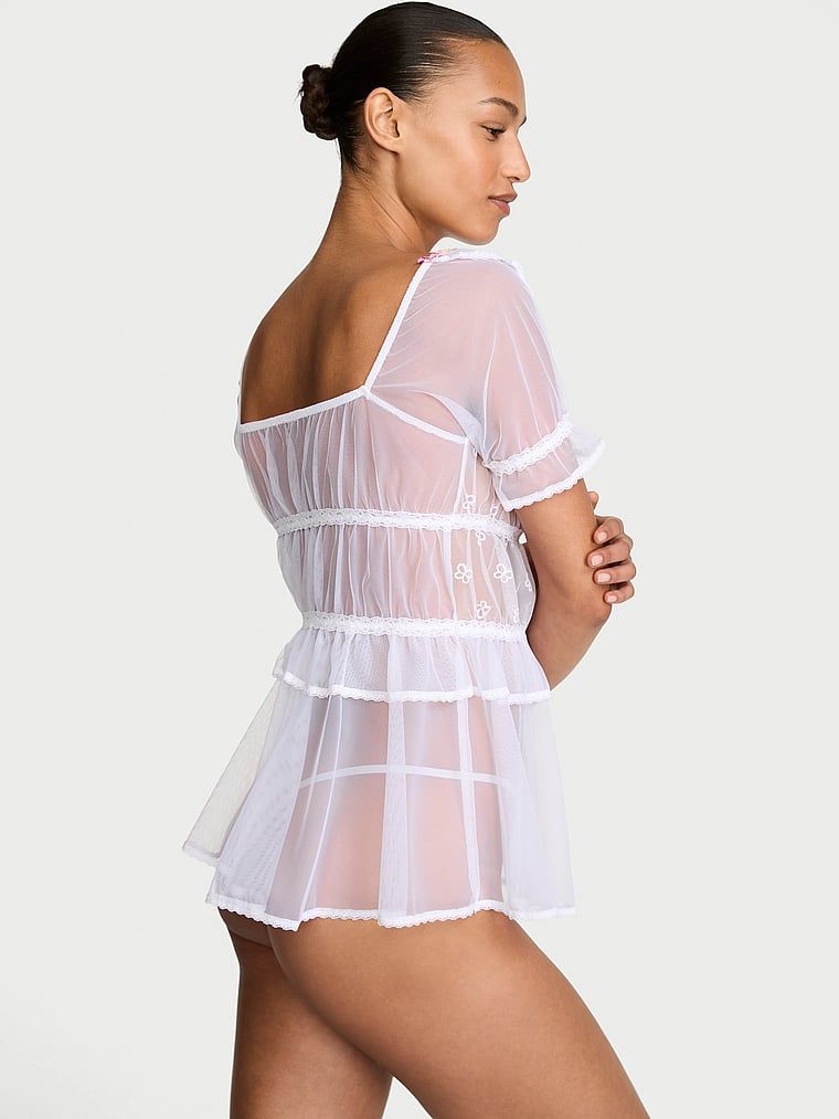 Koszulka prześwitująca i stringi Butterflies Babydoll. Produkt jest wzorzysty i pochodzi z kolekcji Dream Angels. 