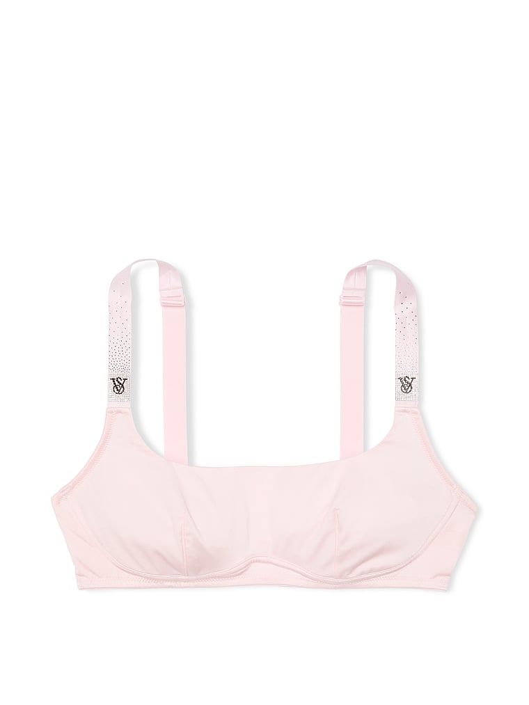 Na zdjęciu na białym tle widoczny jest biustonosz braletka bez fiszbin z błyszczącymi ramiączkami Shine Strap. Produkt ma kolor różowy i pochodzi z kolekcji Very Sexy.