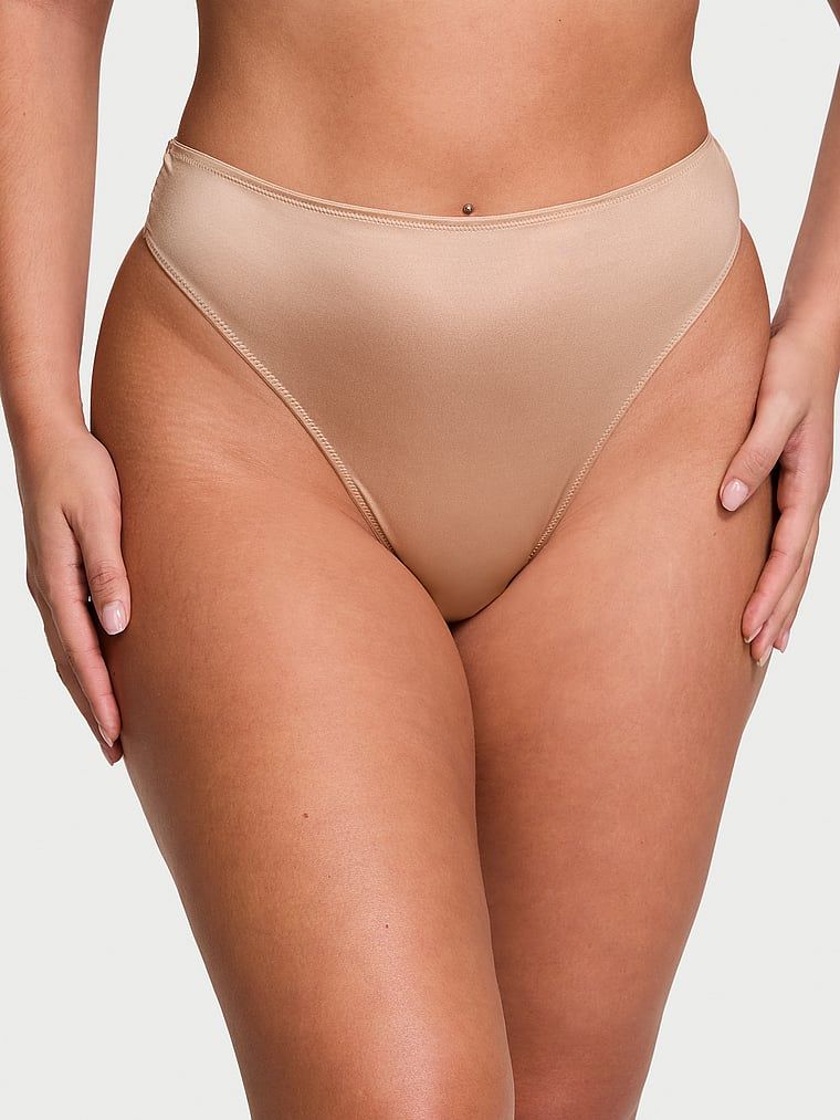 Stringi z wysokim stanem i paseczkami z tyłu Strappy-Back. Produkt ma kolor beżowy i pochodzi z kolekcji Very Sexy. 