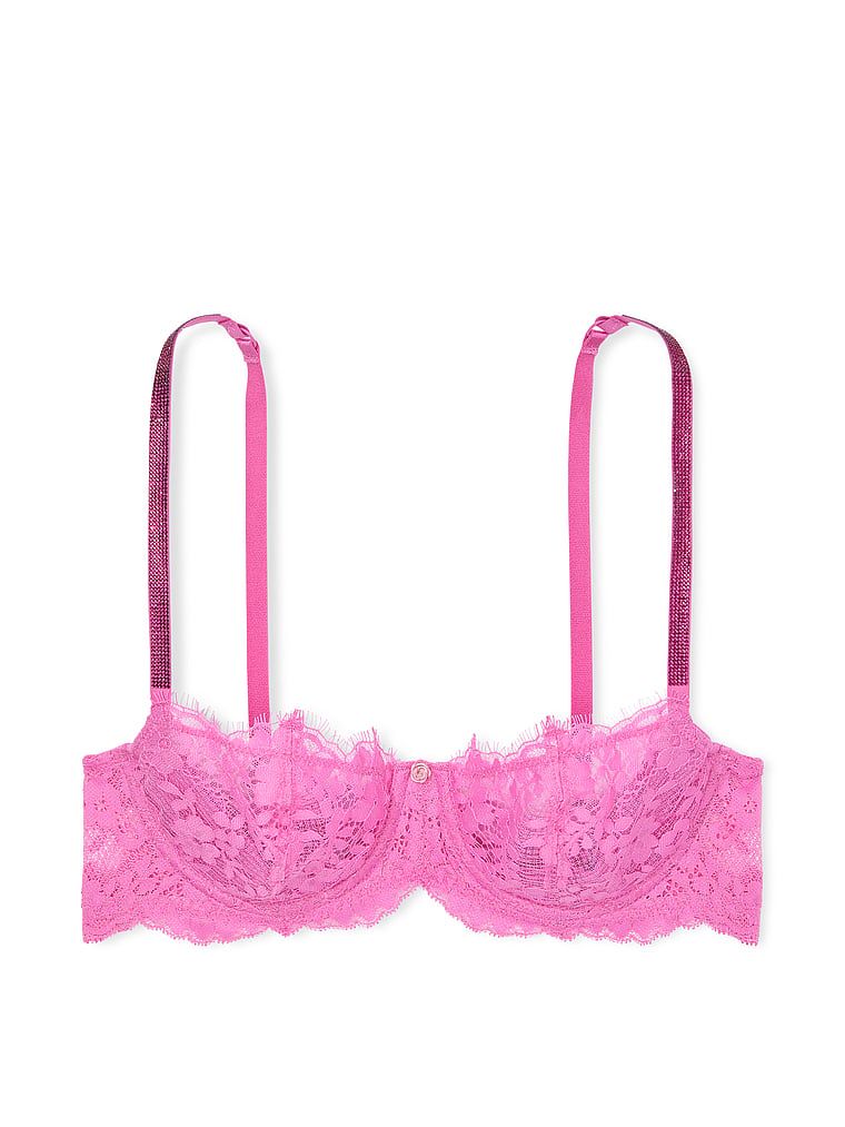 Na zdjęciu na białym tle widoczny jest biustonosz nieusztywniany koronkowy Wicked Twinkle Strap. Produkt ma kolor różowy i pochodzi z kolekcji Dream Angels.