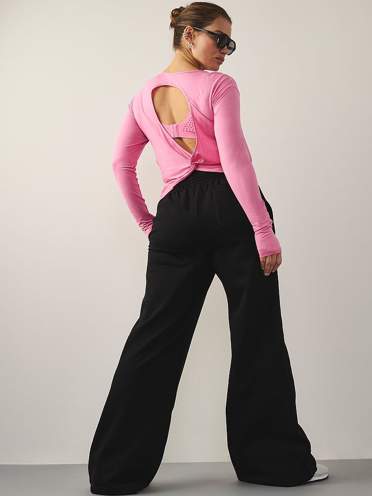 Bluzka z wycięciem z tyłu VSX Drapey. Produkt ma kolor różowy i pochodzi z kolekcji VSX. 