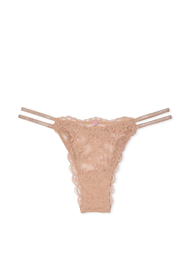 Majtki brazyliany koronkowe z błyszczącymi paseczkami Twinkle Strap Brazilian. Produkt ma kolor beżowy i pochodzi z kolekcji Dream Angels. 
