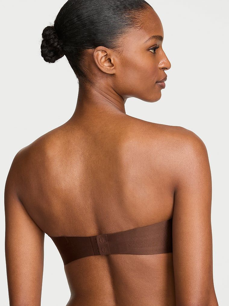 Biustonosz lekko usztywniany bez ramiączek Strapless. Produkt ma kolor brązowy i pochodzi z kolekcji Invisible by Victoria's Secret. 