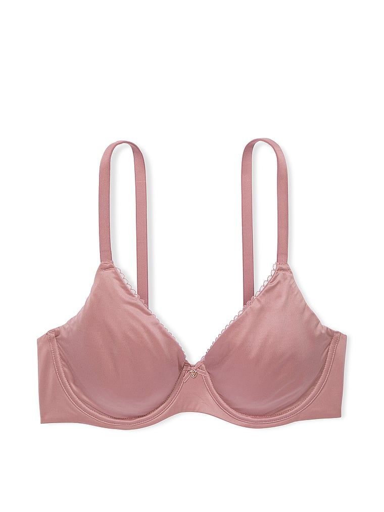 Na zdjęciu na białym tle widoczny jest biustonosz zmniejszający optycznie biust Invisible Lift Minimizer. Produkt ma kolor różowy i pochodzi z kolekcji Body by Victoria.