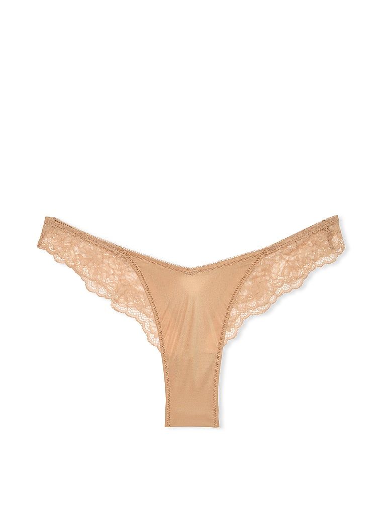Stringi z koronką i wysoko wyciętymi nogawkami Lace-Trim High-Leg. Produkt ma kolor beżowy i pochodzi z kolekcji Very Sexy. 