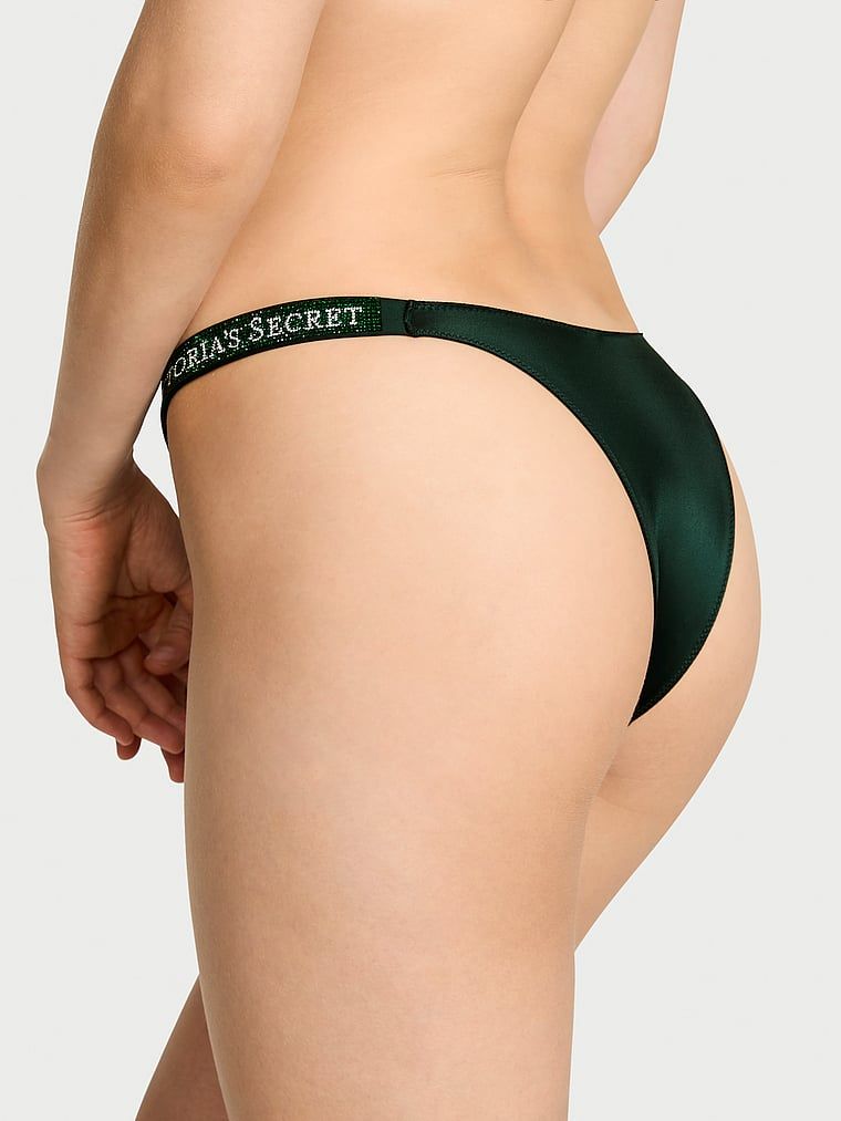 Majtki brazyliany z błyszczącymi paskami Shine Strap Brazilian. Produkt ma kolor zielony i pochodzi z kolekcji Very Sexy. 