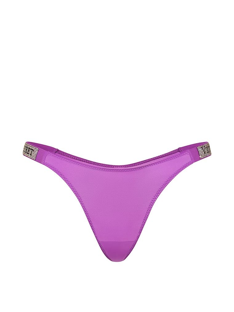 Stringi z błyszczącymi paskami Shine Strap. Produkt ma kolor fioletowy i pochodzi z kolekcji Very Sexy. 