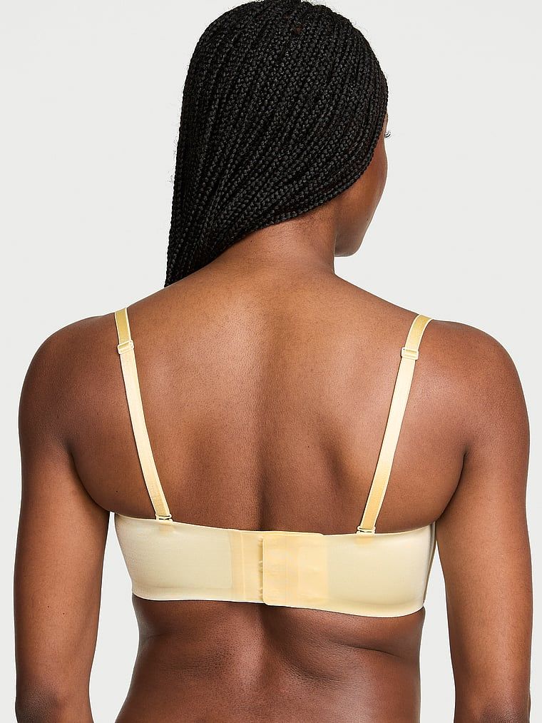 Biustonosz push-up bez ramiączek i bez fiszbin Bandeau. Produkt ma kolor żółty i pochodzi z kolekcji Invisible by Victoria's Secret. 