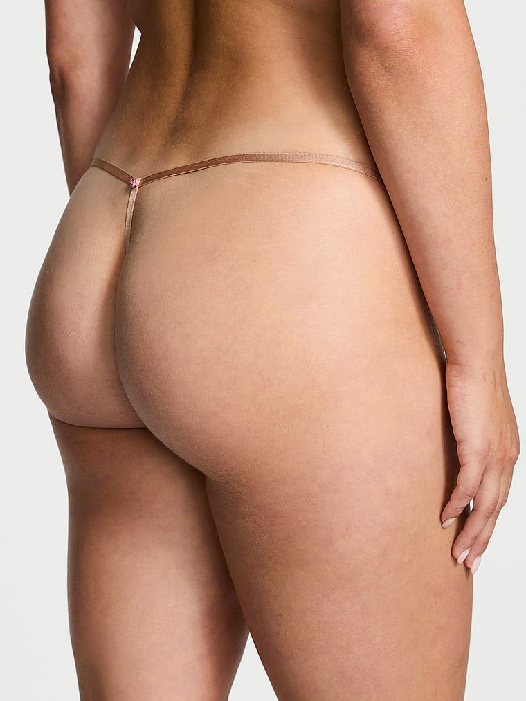 Stringi koronkowe z regulowanymi paskami Lace V-String. Produkt ma kolor beżowy i pochodzi z kolekcji Dream Angels. 