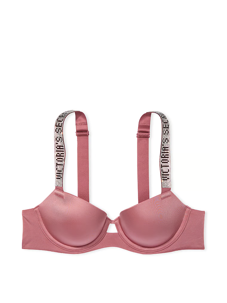 Na zdjęciu na białym tle widoczny jest biustonosz lekko usztywniany z błyszczącymi ramiączkami Shine Strap Demi. Produkt ma kolor różowy i pochodzi z kolekcji Very Sexy.