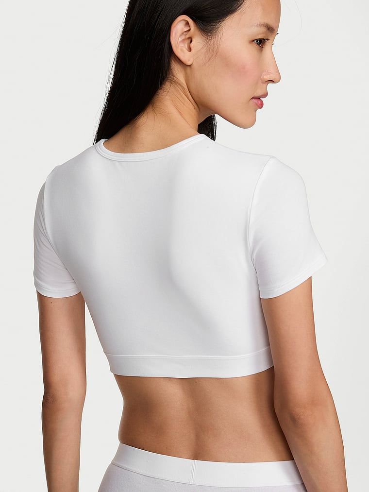 Crop top bawełniany braletka z krótkimi rękawami Shine Patch. Produkt ma kolor biały i pochodzi z kolekcji T-shirt. 