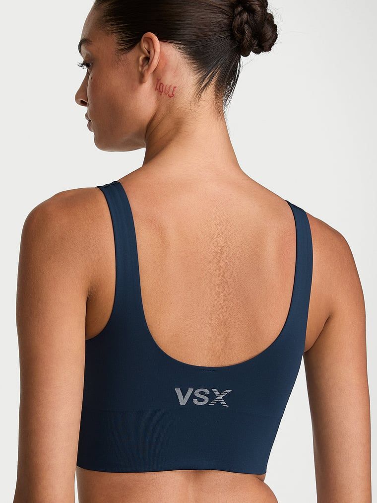 Biustonosz sportowy o gładkim wykończeniu VSX Elevate. Produkt ma kolor niebieski i pochodzi z kolekcji VSX. 