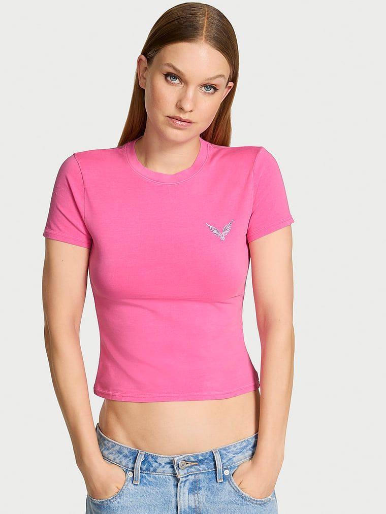 T-shirt bawełniany VSFS 2025. Produkt ma kolor różowy i pochodzi z kolekcji Angel Essentials. 