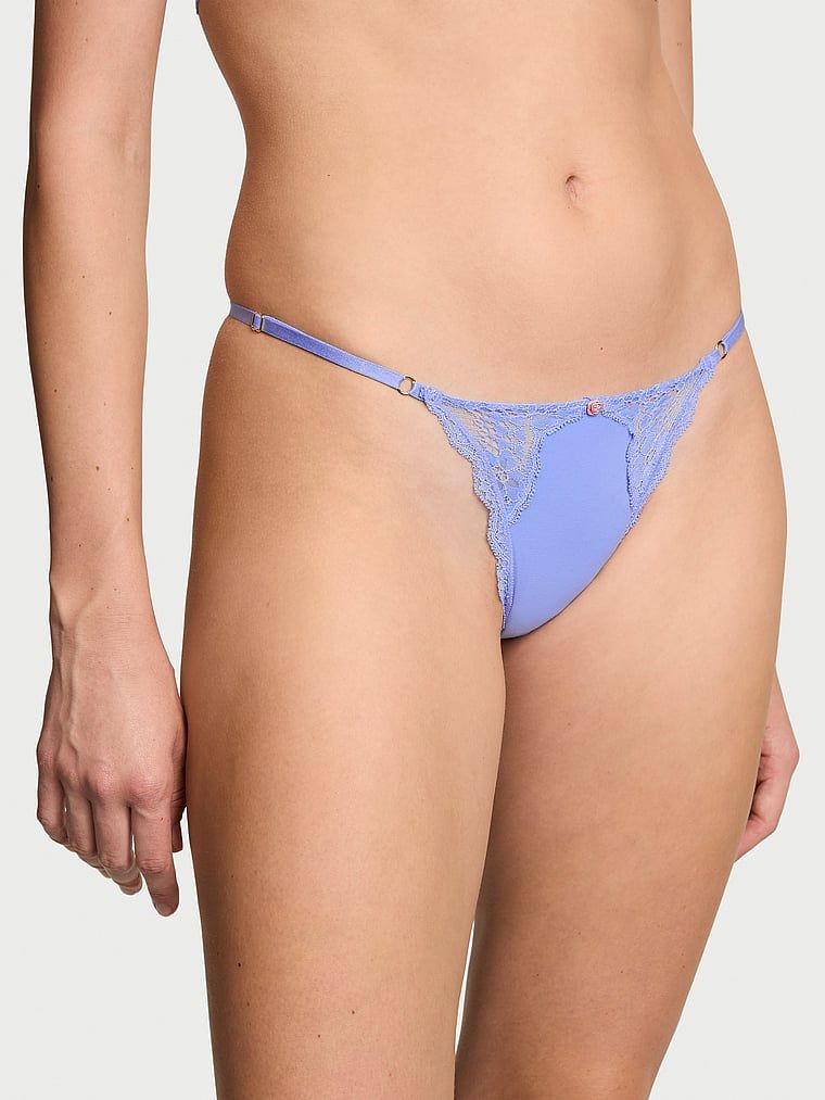 Stringi z koronką z regulowanymi paskami Lace-Trim V-String. Produkt ma kolor purpurowy i pochodzi z kolekcji Dream Angels. 