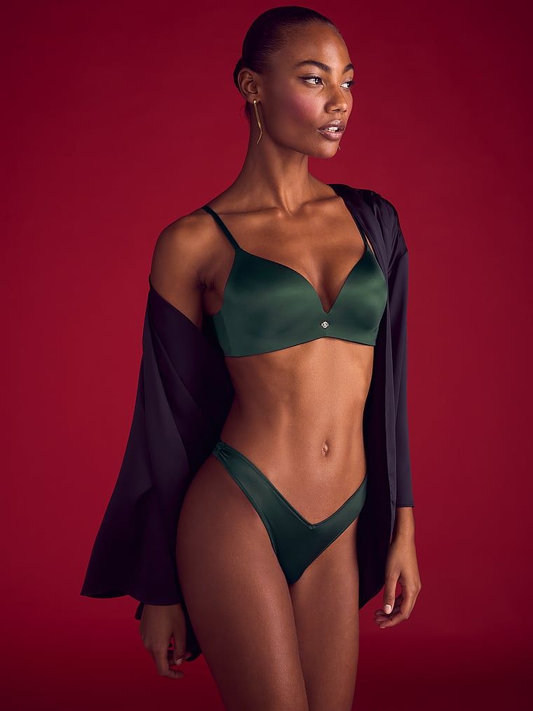 Modelka prezentuje biustonosz push-up bez fiszbin So Obsessed. Produkt ma kolor zielony i pochodzi z kolekcji Very Sexy.