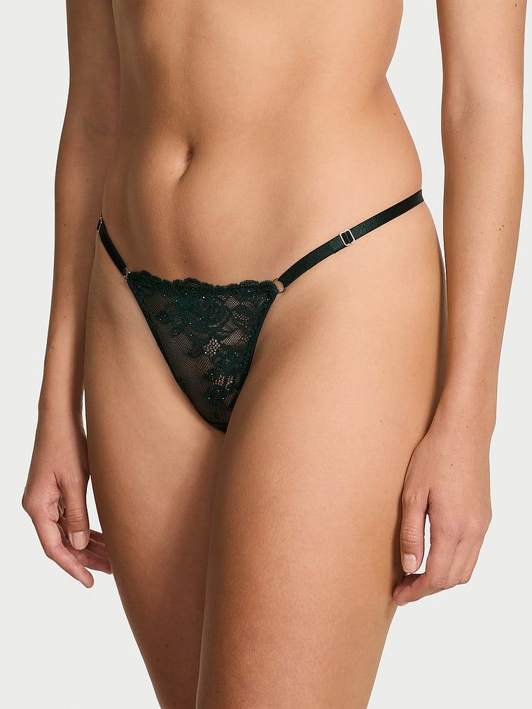 Stringi koronkowe z regulowanymi paseczkami Rose Lace Shimmer. Produkt jest wzorzysty i pochodzi z kolekcji Very Sexy. 