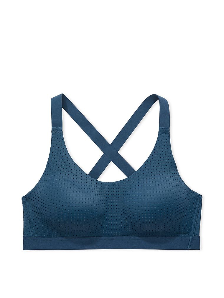 Na zdjęciu na białym tle widoczny jest biustonosz sportowy ze średnim podtrzymaniem Lightweight Mesh. Produkt ma kolor niebieski i pochodzi z kolekcji VSX.