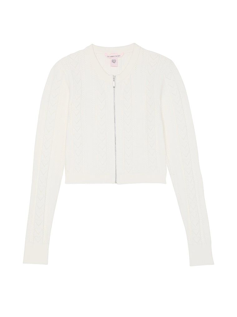 Sweterek crop top na suwak z dziurkowanego materiału Luxe Heart Pointelle. Produkt ma kolor biały i pochodzi z kolekcji Victoria's Secret. 