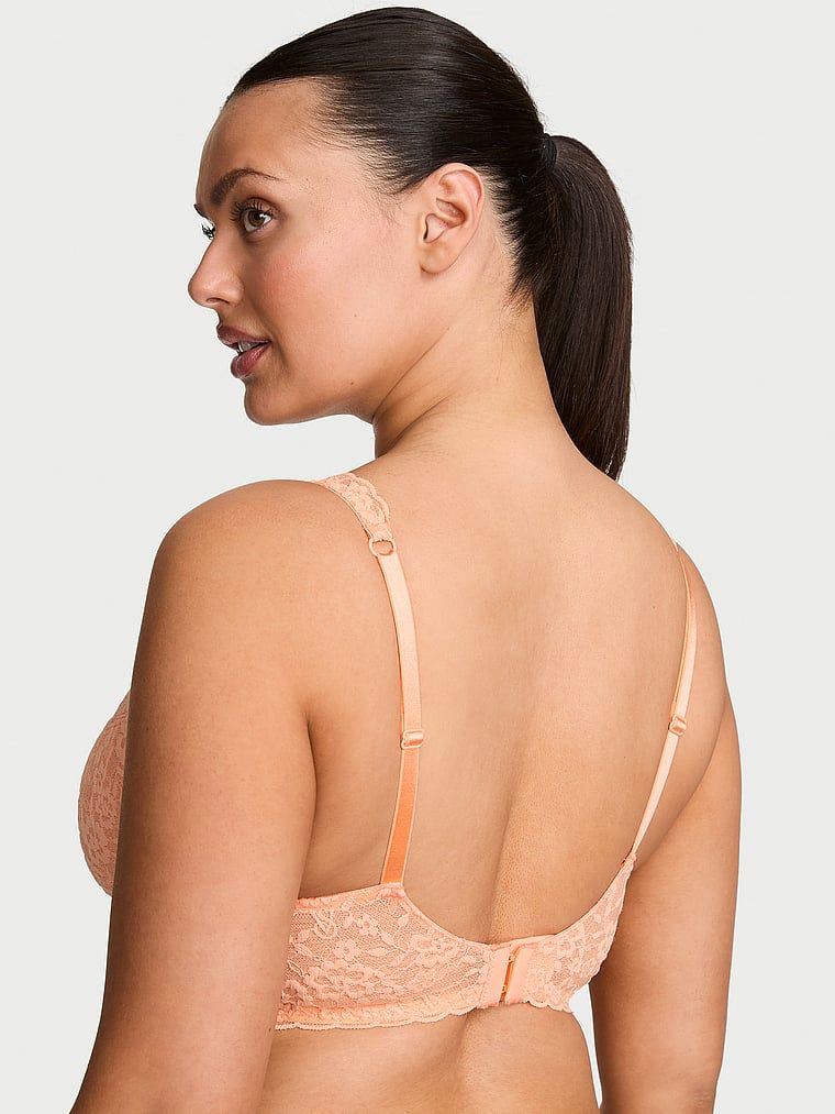 Biustonosz nieusztywniany balkonetka koronkowy. Produkt ma kolor pomarańczowy i pochodzi z kolekcji Victoria's Secret. 