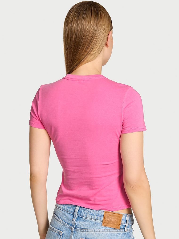 T-shirt bawełniany VSFS 2025. Produkt ma kolor różowy i pochodzi z kolekcji Angel Essentials. 