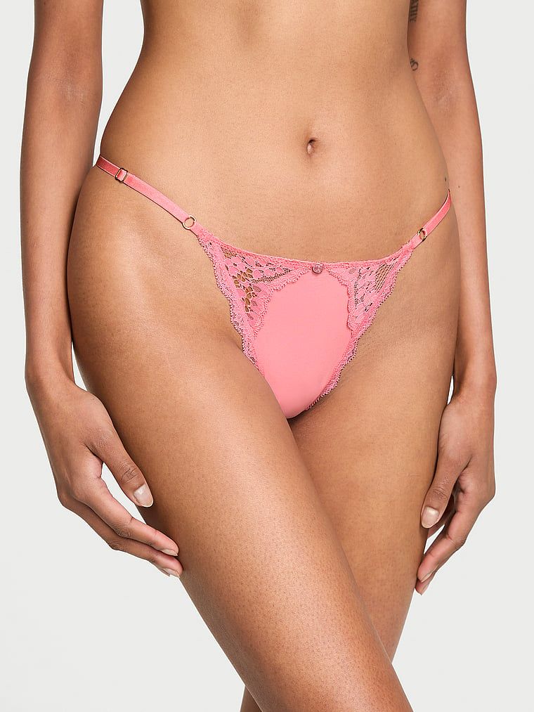 Stringi z koronką z regulowanymi paskami Lace-Trim V-String. Produkt ma kolor różowy i pochodzi z kolekcji Dream Angels. 