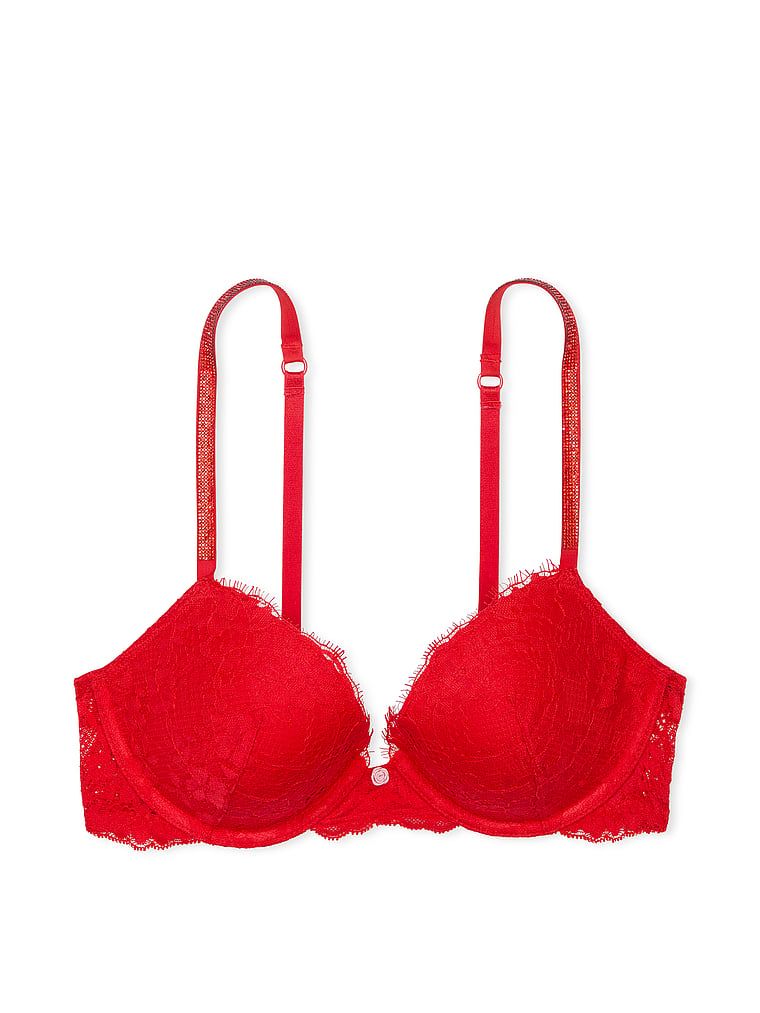 Na zdjęciu na białym tle widoczny jest biustonosz push-up koronkowy z błyszczącymi ramiączkami Twinkle Strap. Produkt ma kolor czerwony i pochodzi z kolekcji Dream Angels.