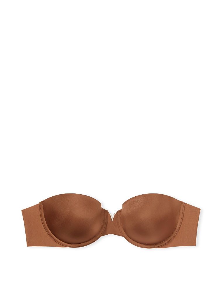 Na zdjęciu na białym tle widoczny jest biustonosz push-up bez ramiączek Sexy Illusions Uplift Strapless. Produkt ma kolor brązowy i pochodzi z kolekcji Victoria's Secret Bare.