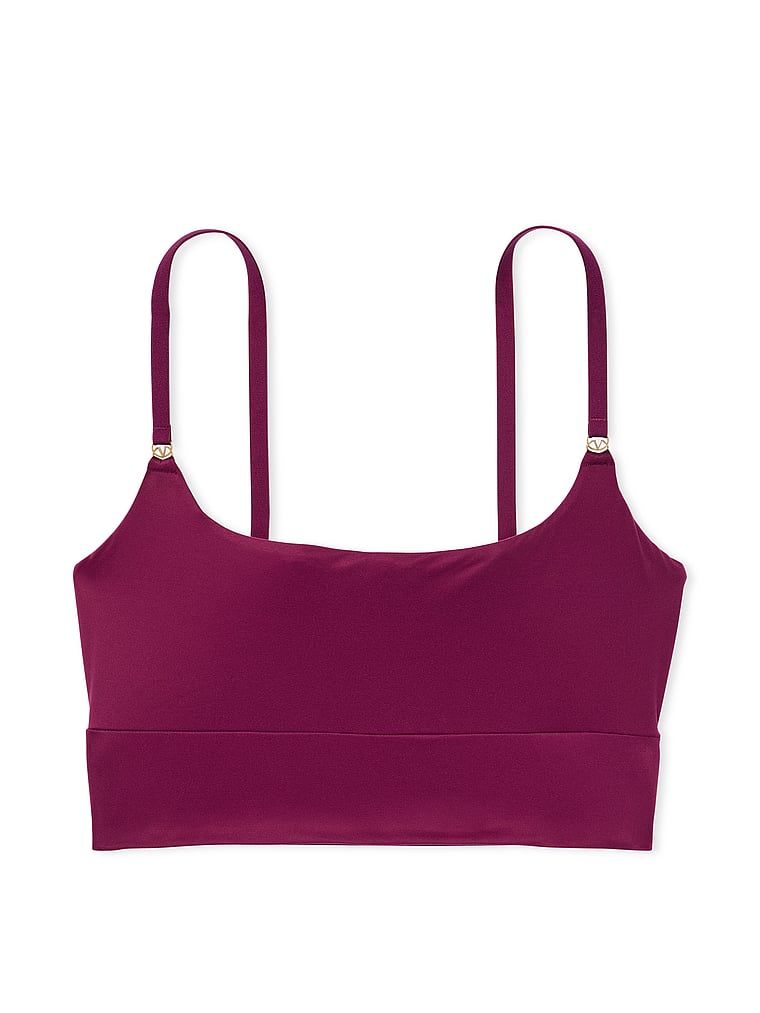 Na zdjęciu na białym tle widoczny jest biustonosz braletka Feathersoft Essentials. Produkt ma kolor czerwony i pochodzi z kolekcji Victoria's Secret.