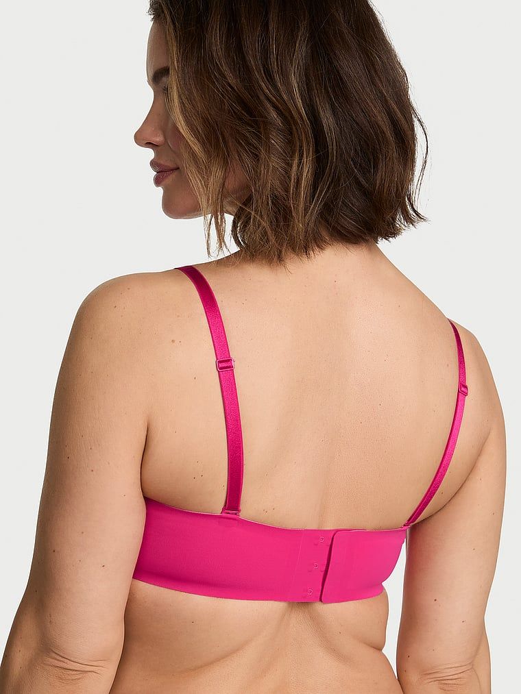 Biustonosz push-up bez ramiączek i bez fiszbin Perfect Comfort Strapless. Produkt ma kolor różowy i pochodzi z kolekcji Victoria's Secret Bare. 