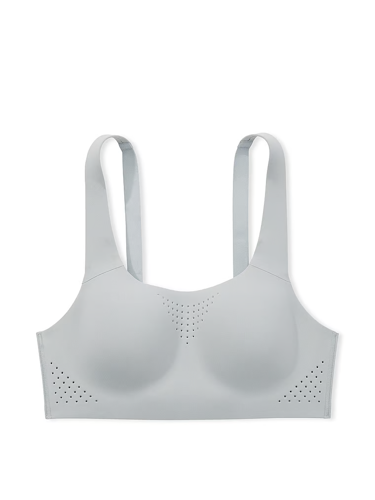 Na zdjęciu na białym tle widoczny jest biustonosz sportowy z maksymalnym podtrzymaniem Featherweight Max. Produkt ma kolor szary i pochodzi z kolekcji VSX.