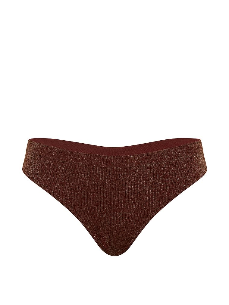 Stringi z błyszczącego materiału Shimmer. Produkt ma kolor brązowy i pochodzi z kolekcji Seamless. 